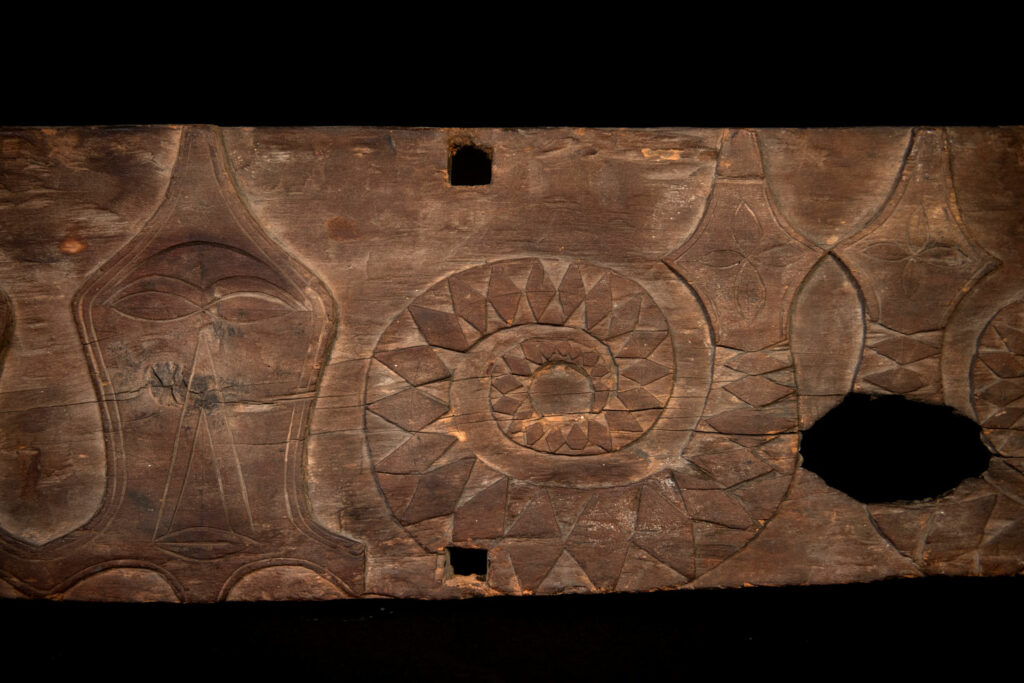 Paiwan tribe house Eave from Majia Township 瑪家鄉 - South Taiwan- Carved with human faces in the Majia style and sacred snakes positioned back to back.