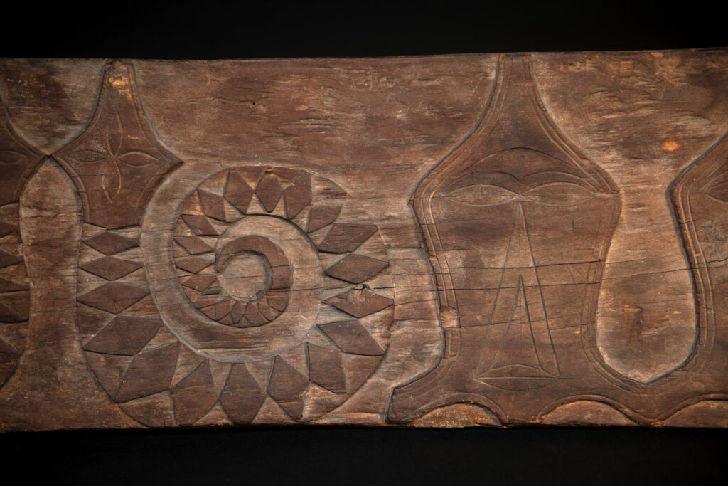 Paiwan tribe house Eave from Majia Township 瑪家鄉 - South Taiwan- Carved with human faces in the Majia style and sacred snakes positioned back to back.