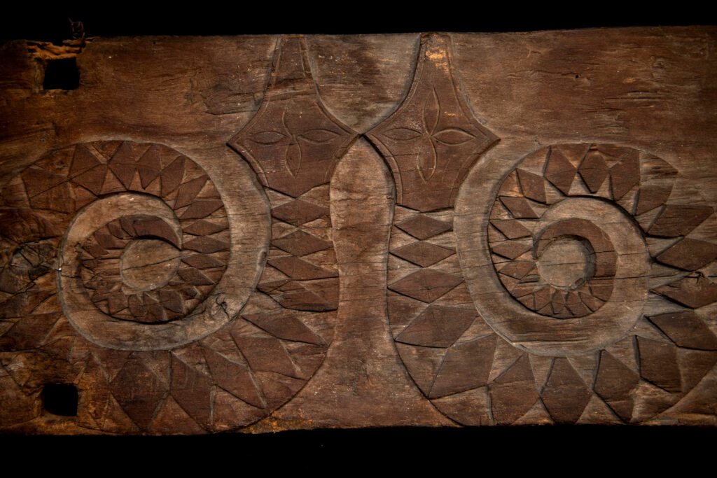 Paiwan tribe house Eave from Majia Township 瑪家鄉 - South Taiwan- Carved with human faces in the Majia style and sacred snakes positioned back to back.