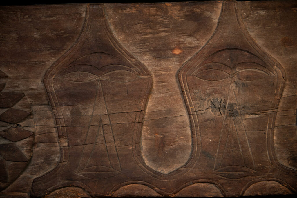 Paiwan tribe house Eave from Majia Township 瑪家鄉 - South Taiwan- Carved with human faces in the Majia style and sacred snakes positioned back to back.