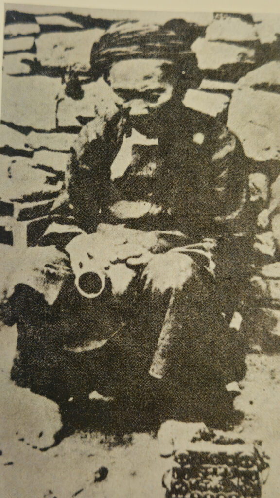 Shaman from the Paiwan tribe holding a divination pot , picture from 1930