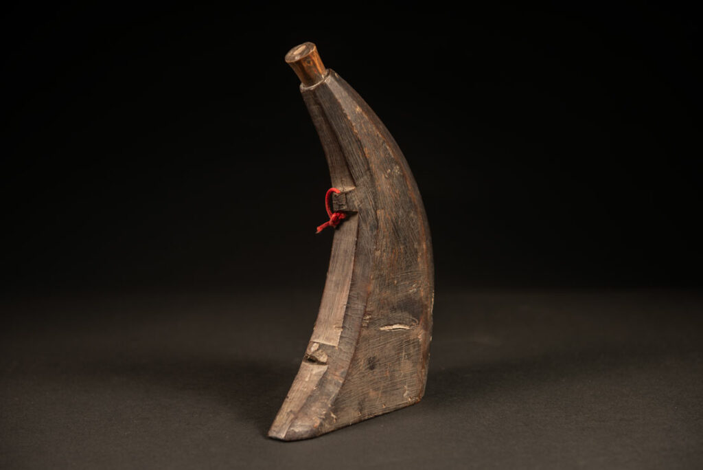 Attayal tribe horn powder flask with a bamboo lid and no carving on it
