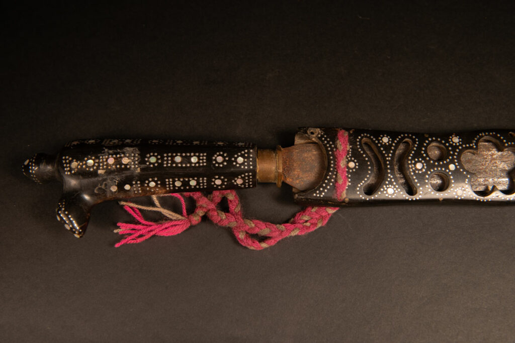 This ceremonial sword from the Ami tribe, features a scabbard and handle made of horn inlaid with mother-of-pearl, in the pure Ami style.