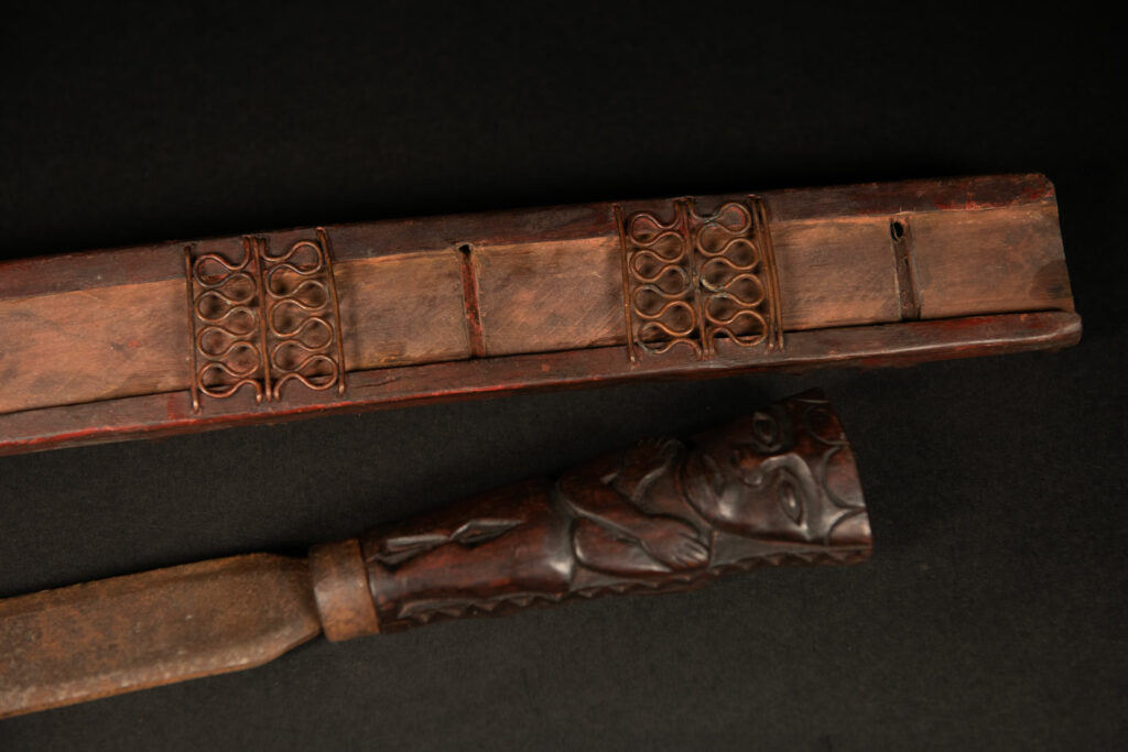 Very beautiful celebration sword from the Puyuma tribe, carved with motifs of a dog chasing a deer, a wild boar, and a human figure.