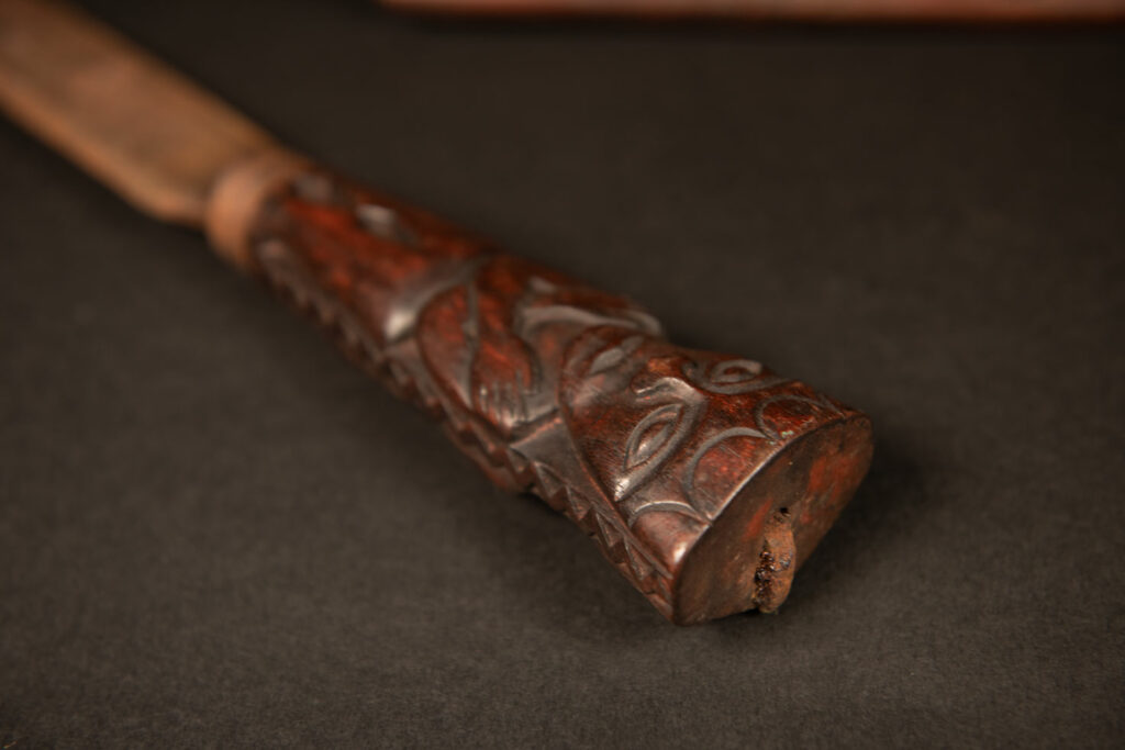 Very beautiful celebration sword from the Puyuma tribe, carved with motifs of a dog chasing a deer, a wild boar, and a human figure.