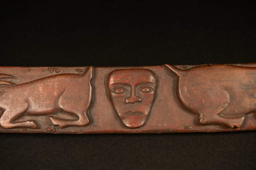 Very beautiful celebration sword from the Puyuma tribe, carved with motifs of a dog chasing a deer, a wild boar, and a human figure.