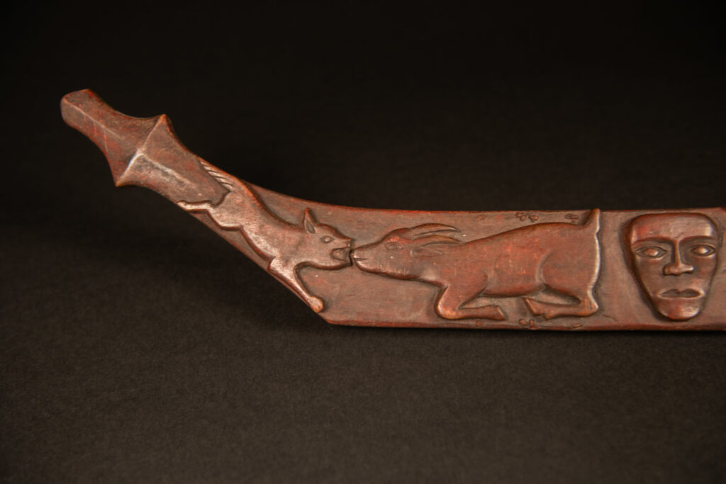 Very beautiful celebration sword from the Puyuma tribe, carved with motifs of a dog chasing a deer, a wild boar, and a human figure.