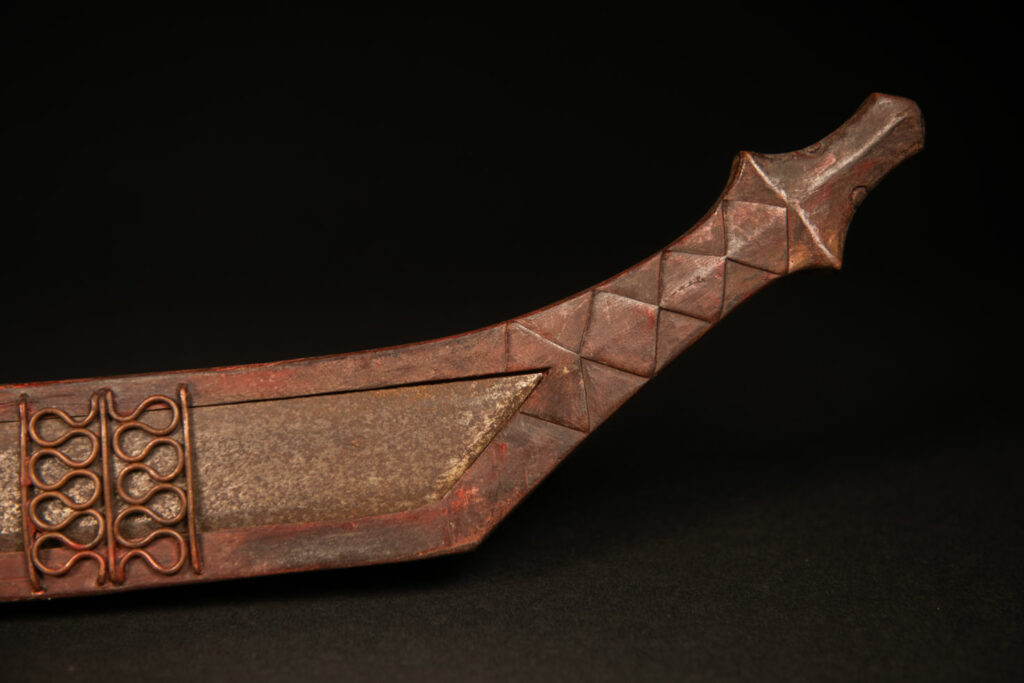 Very beautiful celebration sword from the Puyuma tribe, carved with motifs of a dog chasing a deer, a wild boar, and a human figure.