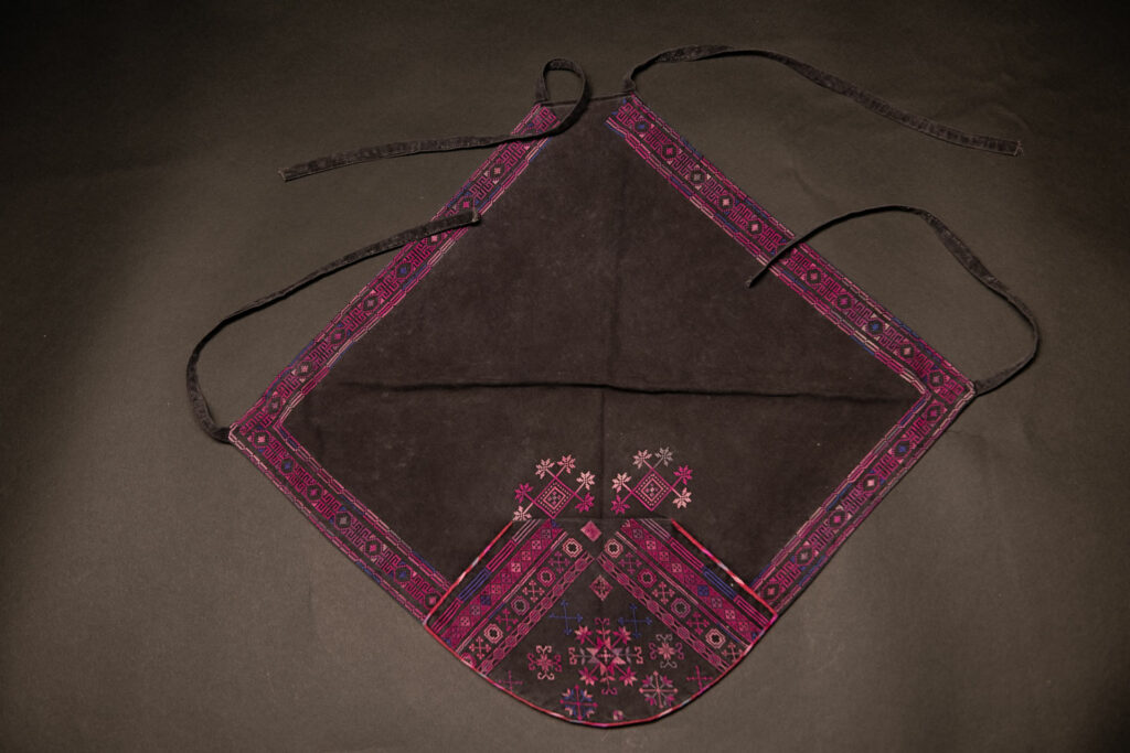 Female chest covering Puyuma tribe . The chest covering is crafted in a diamond shape and features intricate embroidery.