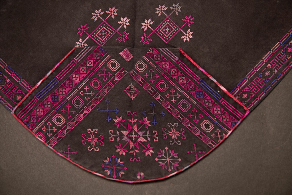 Female chest covering Puyuma tribe . The chest covering is crafted in a diamond shape and features intricate embroidery.