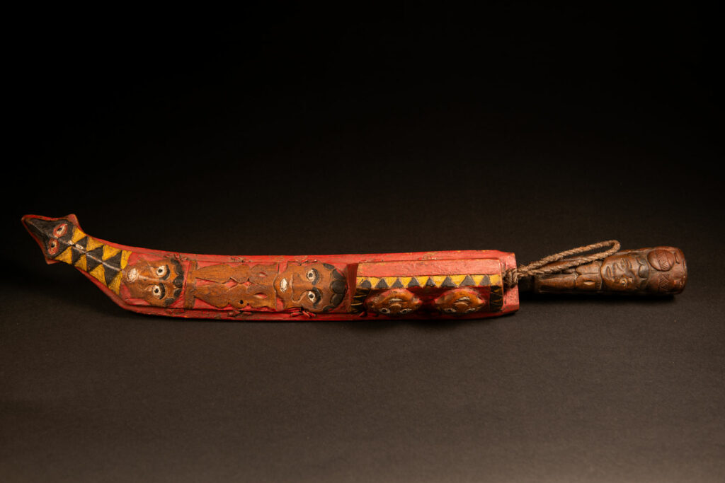Paiwan hunter sword carved with faces and snake and paint