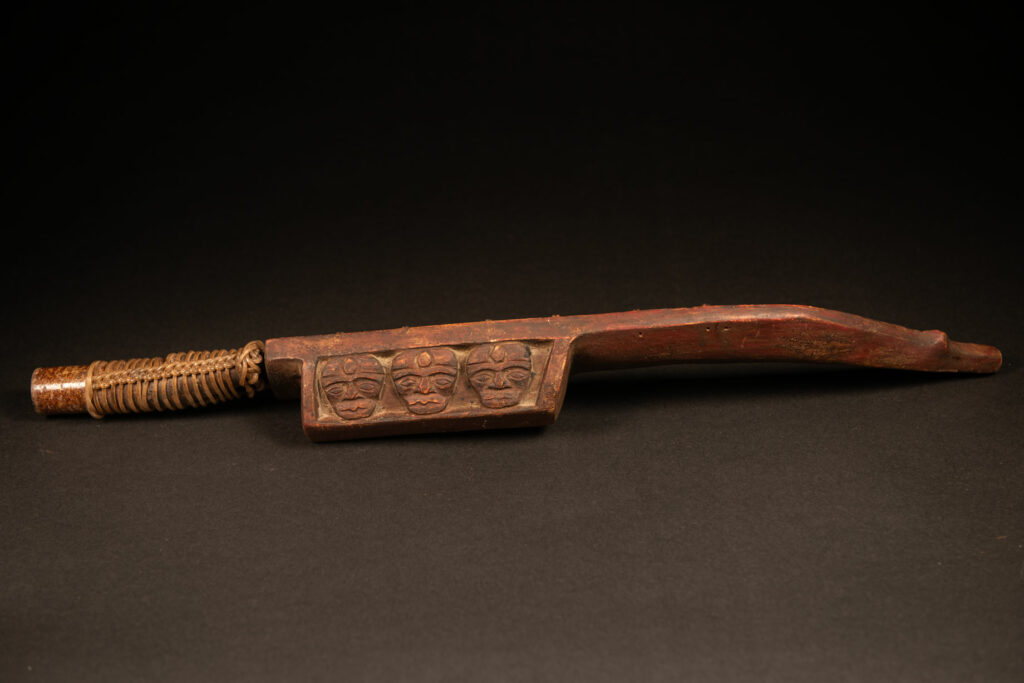 Paiwan tribe Hunter sword carved with snake at the front and 3 human faces at the side