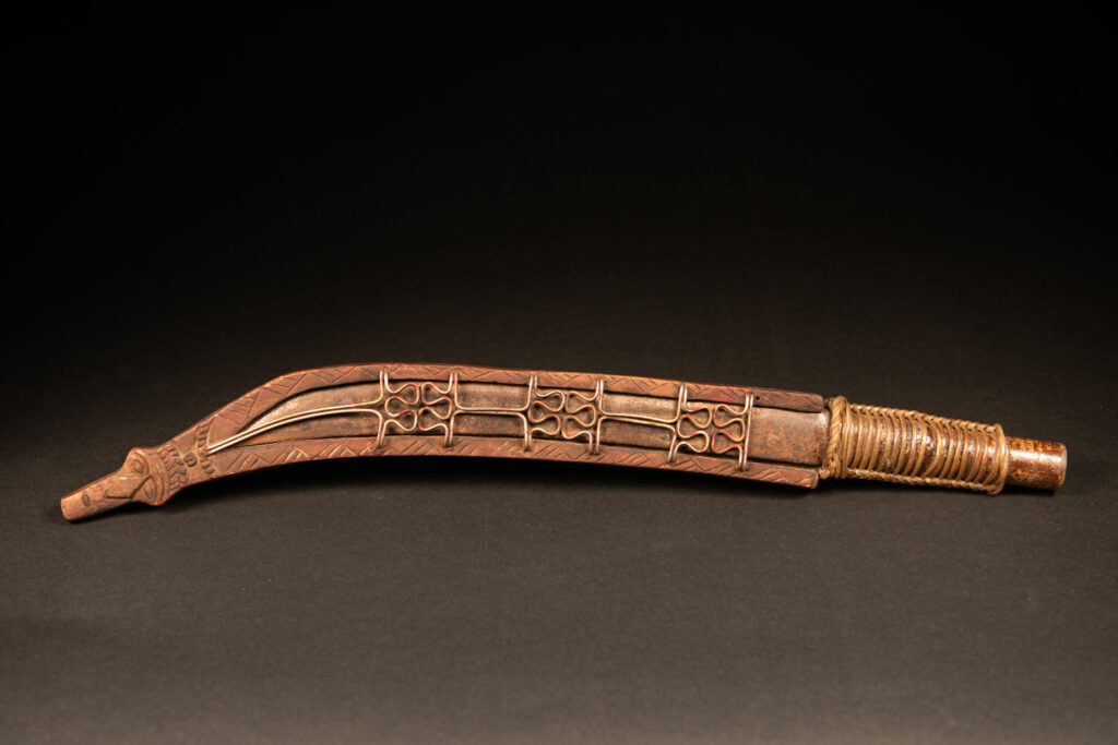 Paiwan tribe Hunter sword carved with snake at the front and 3 human faces at the side