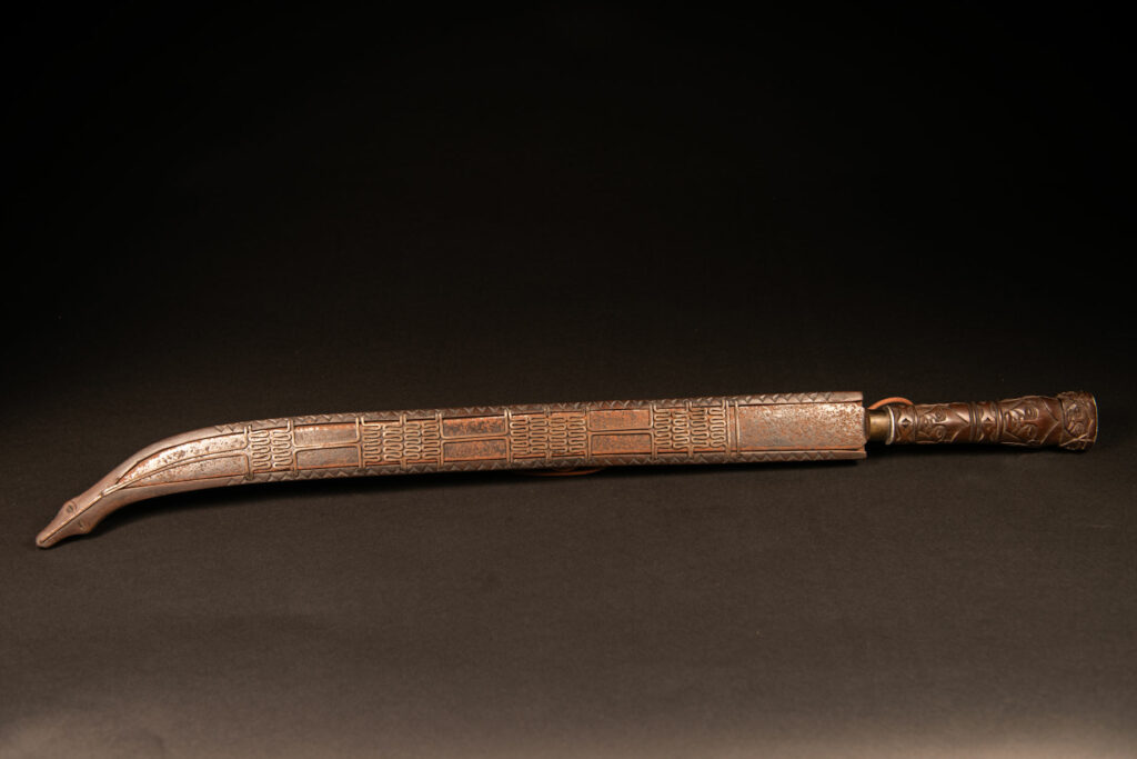 Very beautiful ceremonial sword from the Paiwan tribe, carved with full-length human figures and faces on the side.
