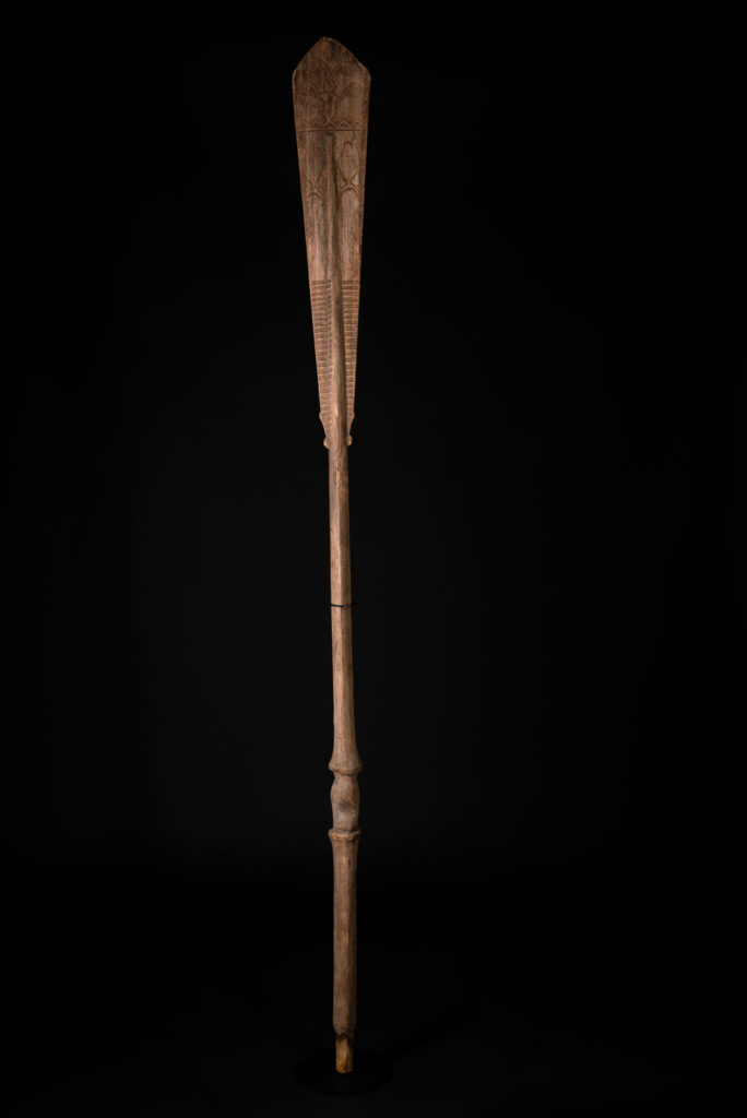 Ceremonial paddle from the Yami tribe (Orchid Island), carved with the deity Magamaog and two fish.