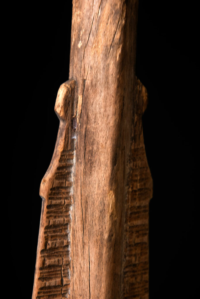 Ceremonial paddle from the Yami tribe (Orchid Island), carved with the deity Magamaog and two fish.