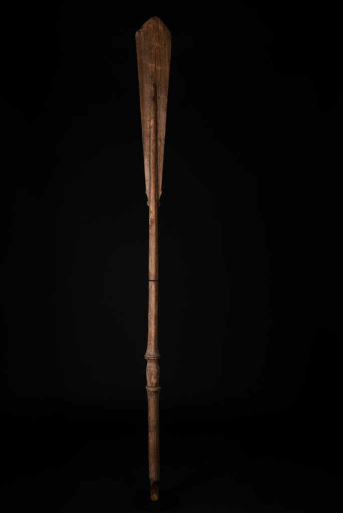 Ceremonial paddle from the Yami tribe (Orchid Island), carved with the deity Magamaog and two fish.