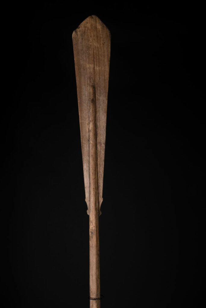 Ceremonial paddle from the Yami tribe (Orchid Island), carved with the deity Magamaog and two fish.