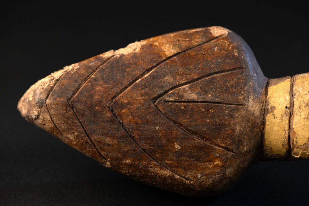 This painted snake sculpture frequently found in Paiwan houses holds a spiritual significance comparable to that of the crucifix for Christians.