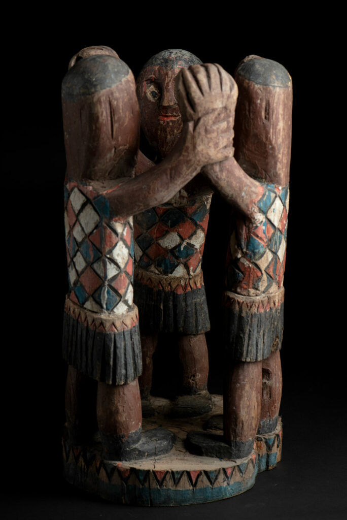 Painted wooden statue depicting figures performing a ritual dance – Paiwan tribe