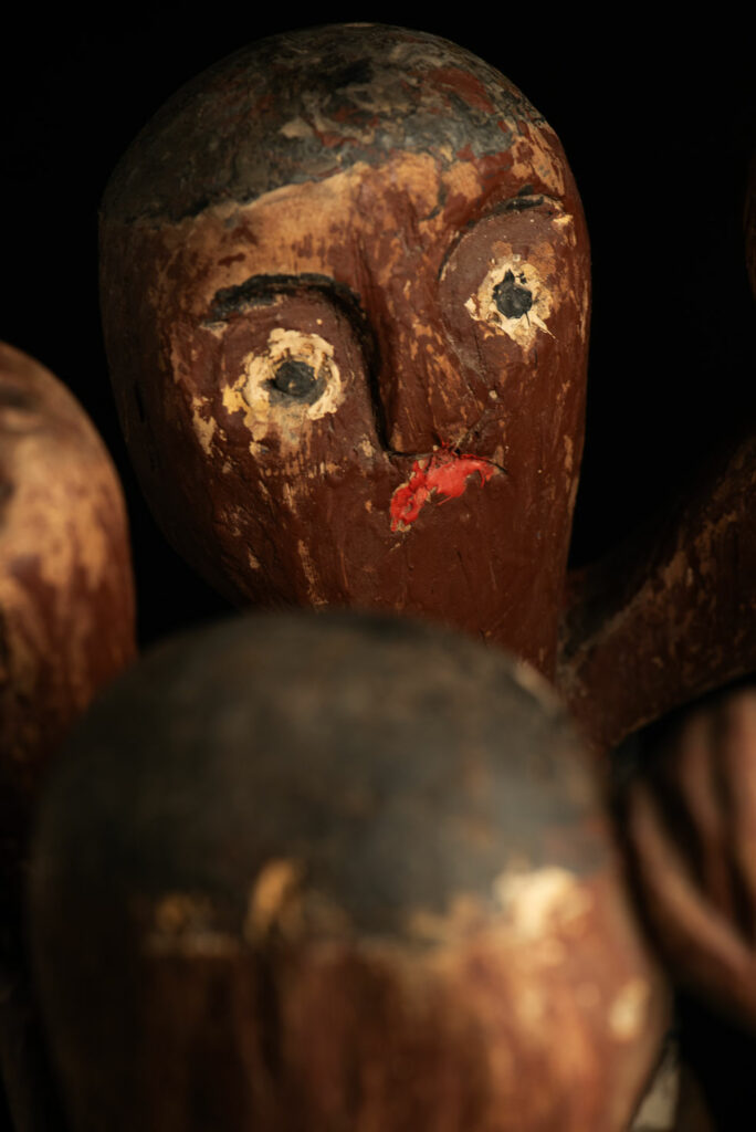 Painted wooden statue depicting figures performing a ritual dance – Paiwan tribe