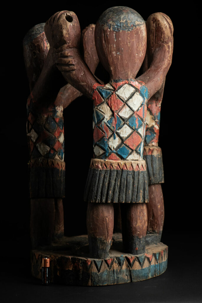 Painted wooden statue depicting figures performing a ritual dance – Paiwan tribe
