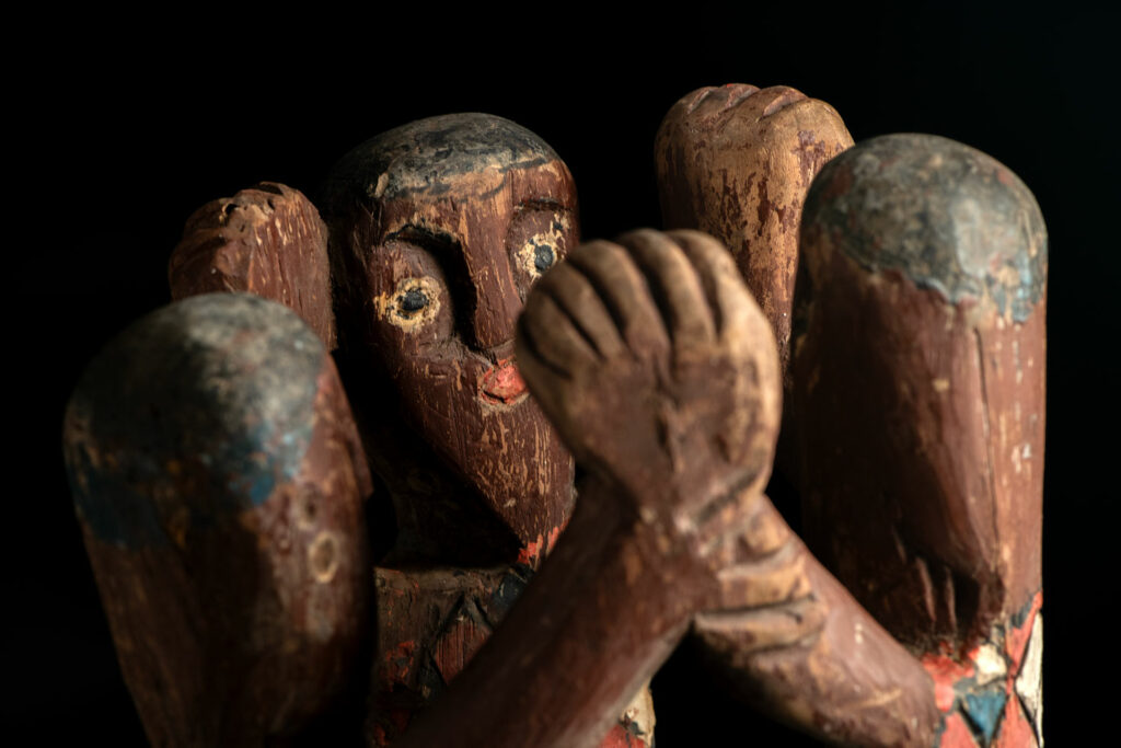 Painted wooden statue depicting figures performing a ritual dance – Paiwan tribe
