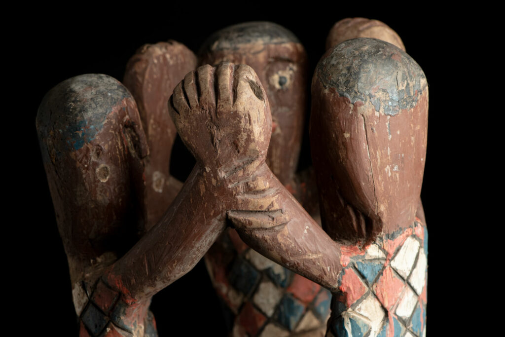 Painted wooden statue depicting figures performing a ritual dance – Paiwan tribe