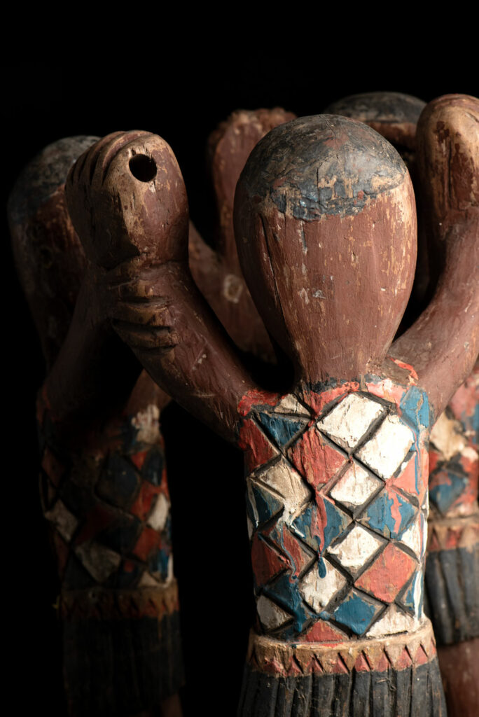 Painted wooden statue depicting figures performing a ritual dance – Paiwan tribe