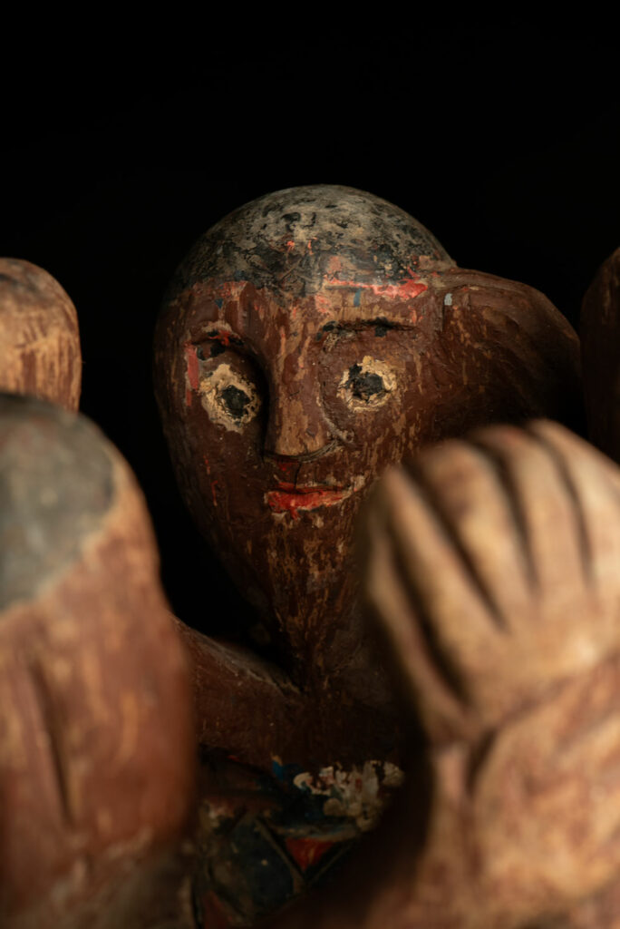 Painted wooden statue depicting figures performing a ritual dance – Paiwan tribe