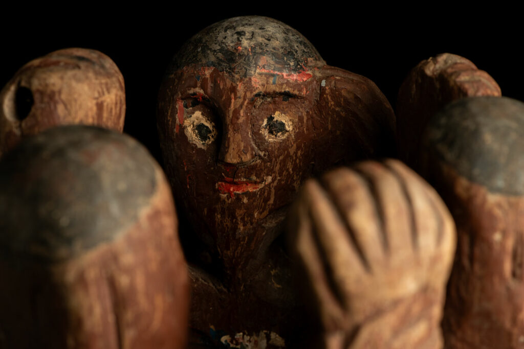 Painted wooden statue depicting figures performing a ritual dance – Paiwan tribe