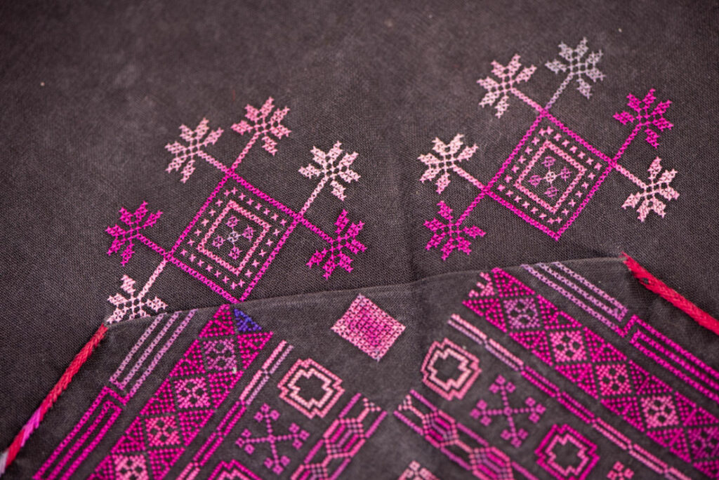 Female chest covering Puyuma tribe . The chest covering is crafted in a diamond shape and features intricate embroidery.