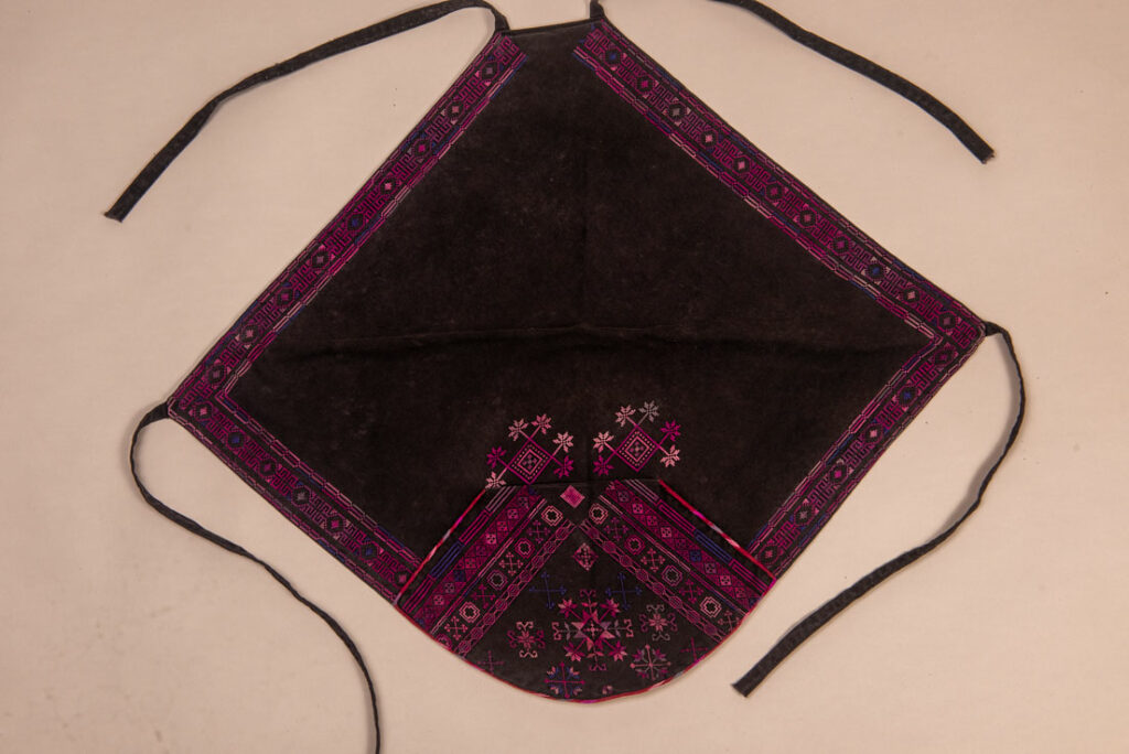 Female chest covering Puyuma tribe . The chest covering is crafted in a diamond shape and features intricate embroidery.