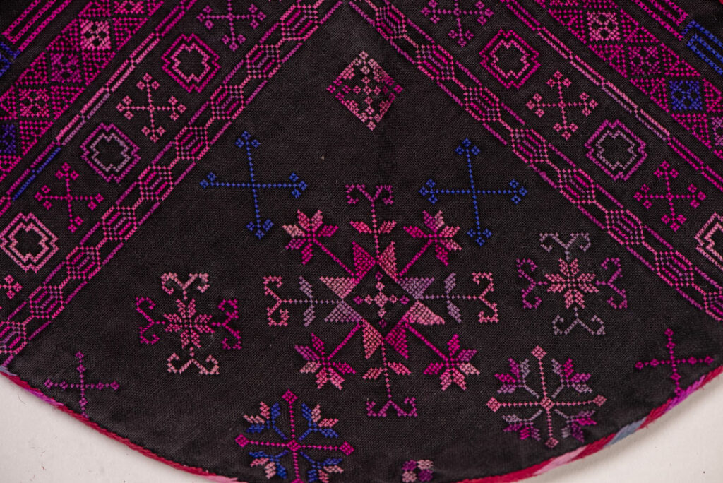 Female chest covering Puyuma tribe . The chest covering is crafted in a diamond shape and features intricate embroidery.