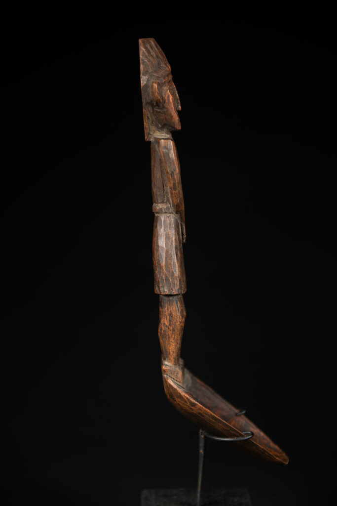 Large spoon from the Paiwan tribe, carved with a Paiwan man in traditional attire. Very finely carved.