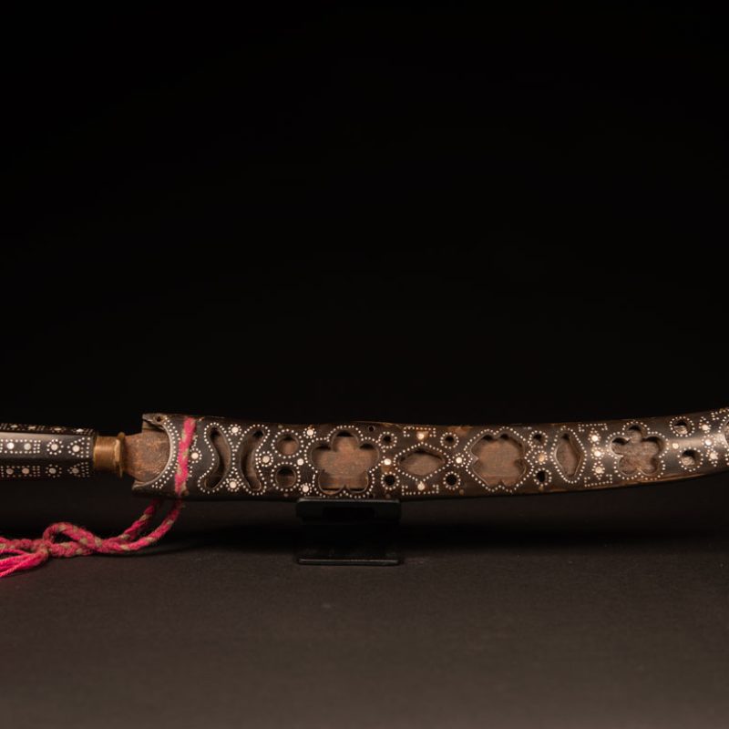 This ceremonial sword from the Ami tribe, features a scabbard and handle made of horn inlaid with mother-of-pearl, in the pure Ami style.