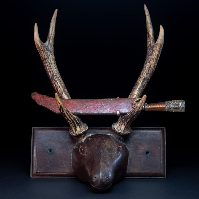 Rukai tribe short knife worn in complement of the sword . sheath red painted