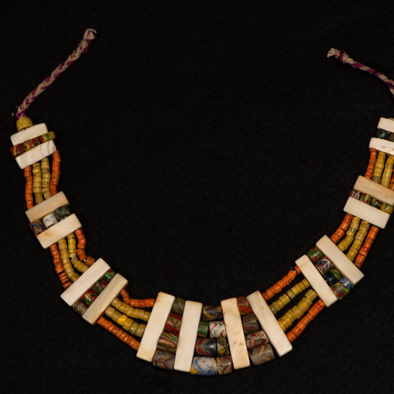 Paiwan tribe old Glass beads collar In Paiwan society, ancient and valuable glass beads are treasured as heirlooms or betrothal gifts, symbolizing aristocratic status. These beads are often carefully stored in old pottery jars.