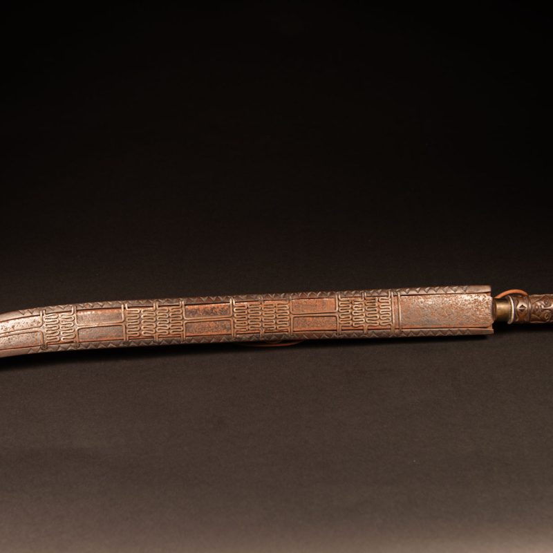 Very beautiful ceremonial sword from the Paiwan tribe, carved with full-length human figures and faces on the side.