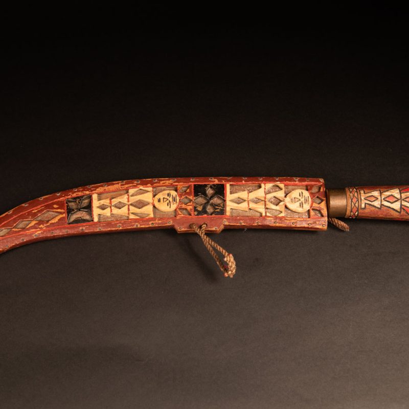 word from the Rukai tribe, painted in red, white, and black, engraved with serpent motifs and stylized human figures.