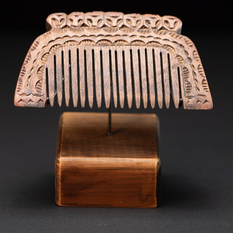 Ancient Paiwan tribe wooden Comb carved with seven human figures on the top and snake pattern