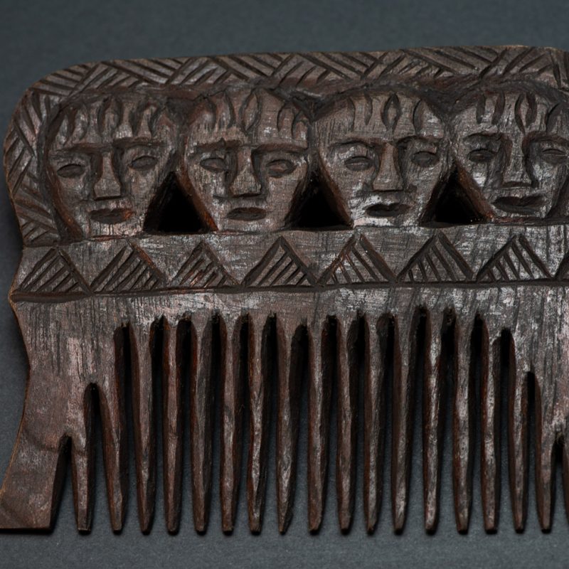 Paiwan tribe wooden Comb carved with four human faces