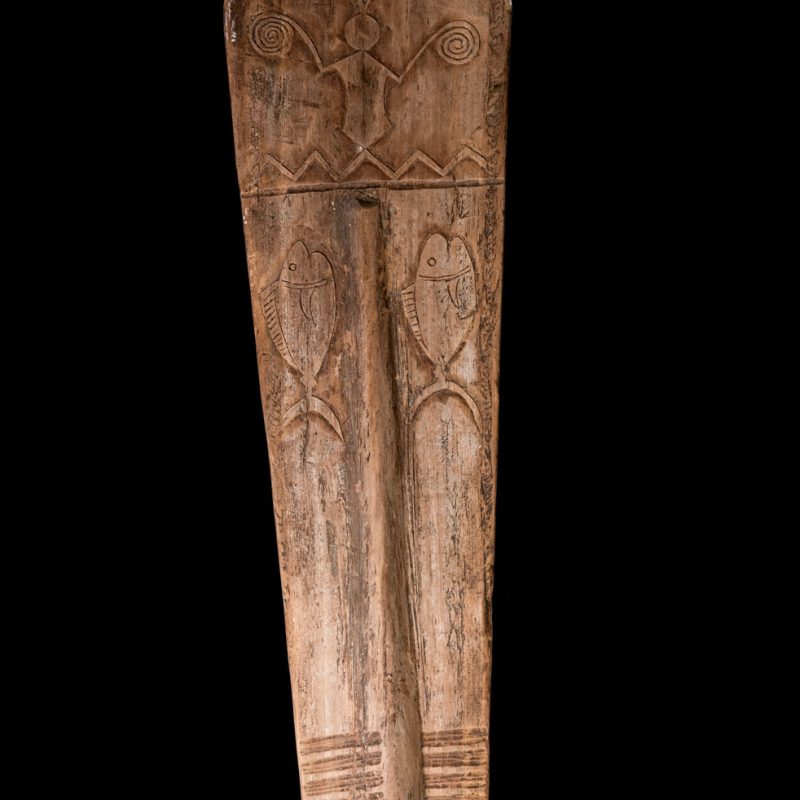 Ceremonial paddle from the Yami tribe (Orchid Island), carved with the deity Magamaog and two fish.